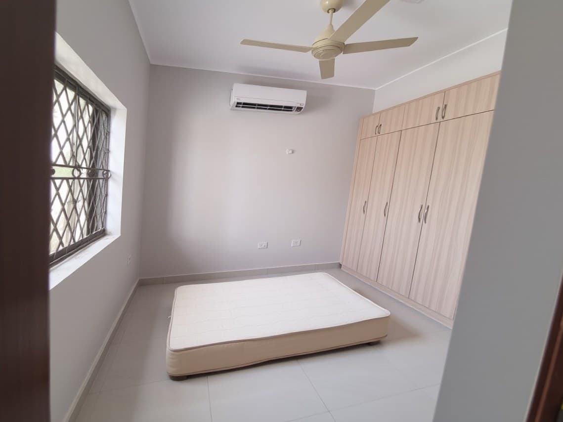Bedroom before: an empty apartment room